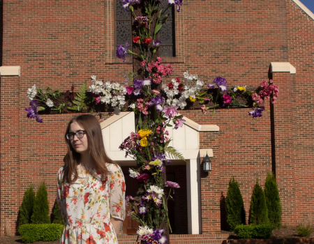 Photograph of Woman in Front of Church